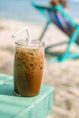Enjoying an iced coffee on the beach