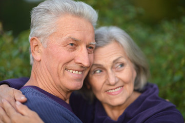 Happy elderly couple embracing