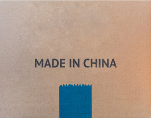 MADE IN CHINA written on brown cardboard box with copy-space for your text.