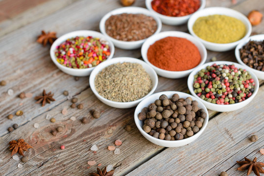 Various spices on wooden spoons. Food ingredients