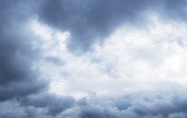 Heavy grey clouds in the sky before snow falling.