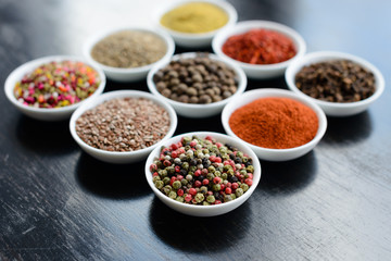 Various spices on wooden spoons. Food ingredients