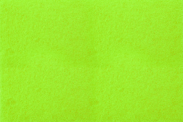 Naklejka na ściany i meble A green rectangle made of knitted material.
