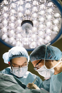 Surgeons doing surgery in operating room
