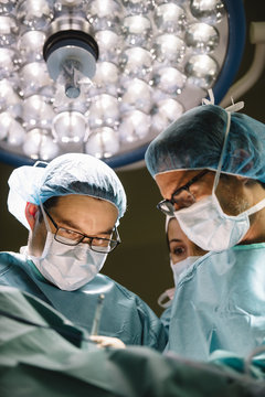 Surgeons operating