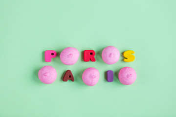 photo of pink marshmallows and colorful letters on the wonderful green background