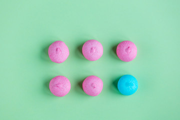 photo of tasty pink and blue marshmallows on the wonderful green studio background