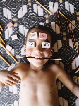 Boy with erasers on face