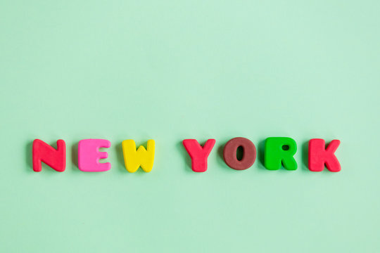 photo of colorful letters on the wonderful green studio background