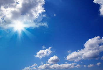Naklejka na ściany i meble cloudscape image of clear blue sky with shining sun.
