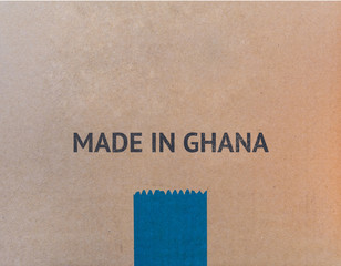 MADE IN GHANA written on brown cardboard box with copy-space for your text.