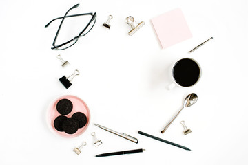 Pale pink home office workspace desk frame with coffee, cookies, glasses and office stuff on white background. Flat lay, top view. Entrepreneur office concept.