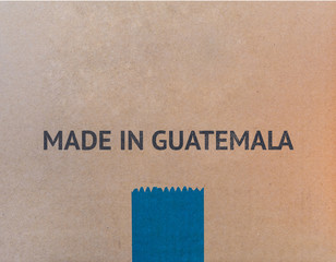 MADE IN GUATEMALA written on brown cardboard box.