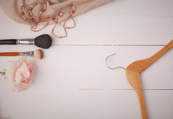 Woman clothing and accessories placed on a wooden background
