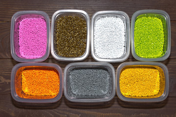 Polymeric dye for plastics. Pigment in the granules on a light background. 