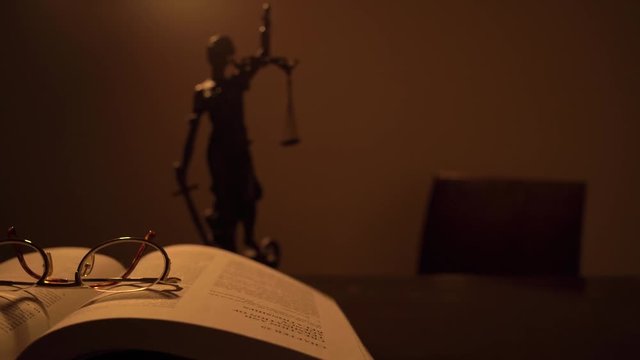 Opened Law Book on Judge's Table Background