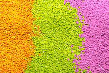 Polymeric dye for plastics. Pigment in the granules on a light background. 