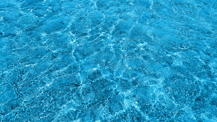 Shining blue water ripple background