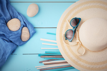 Sunglasses on hat in room, travel concept