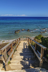 Fototapeta na wymiar Wooden stairs near the beach