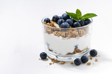 dessert with fresh blueberries, granola and cream