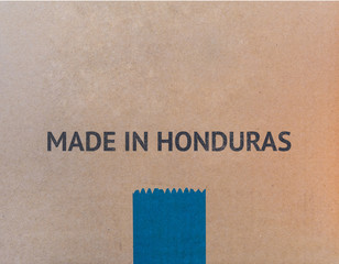 MADE IN HONDURAS written on brown cardboard box with copy-space for your text.