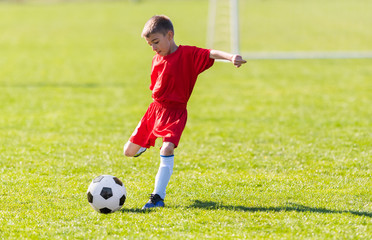 Kids soccer football - children players match on soccer field