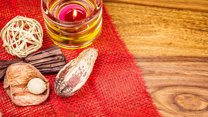 Potpourri and cinnamon sticks on burlap background