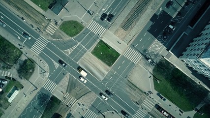 Aerial shot of urban road intersection on a sunny day, top view