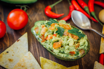 Avocado boat - guacamole dip in boat made from avocado skin.
