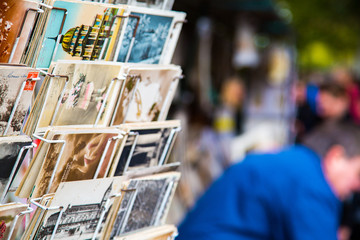 Selling old vintage postcards on the strets of Paris, France.