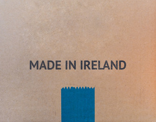 MADE IN IRELAND written on brown cardboard box with copy-space for your text.