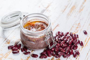 Selection of colorful hummus in jars