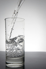 water splashing from glass with copyspace