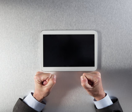 angry businessman hands expressing impatience, frustration or stress facing tablet