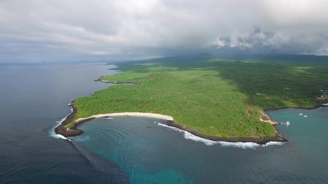 Aerial view of lush jungle landscape of San Cristobal island coast, tropical paradise of Puerto Baquerizo Moreno, Galapagos capital, Ecuador