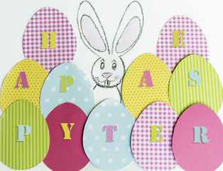 easter card with paper eggs , bunny  and happy easter sign 