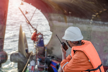 foreman in command repairing the ship in dock yard background