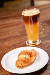 up of coffee and croissant