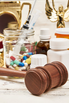 Medicines and juge's hammer. Verdict for doping in sport.