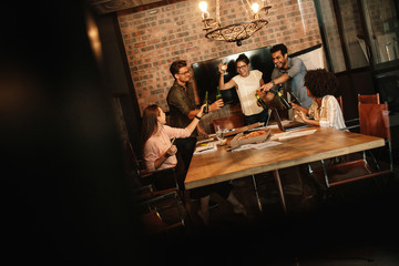 Team celebrating successful business deal