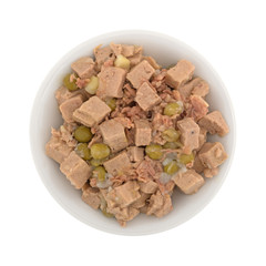Top view of a bowl of lamb and duck dog food isolated on a white background.
