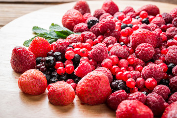 Frozen mixed berries as background.