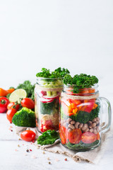 Healthy vegan salad in a mason jar with quinoa