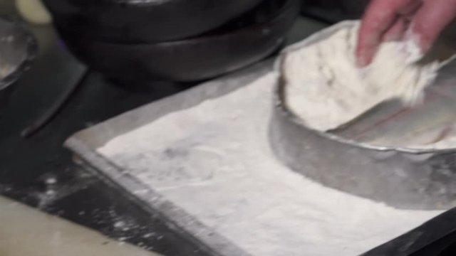 Chef dredging the fish before frying