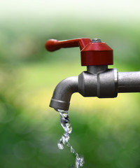 Faucet water blue nature background