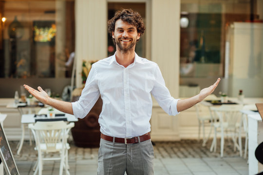 Handsome Man Standing Outside In Front Of His Restaurant