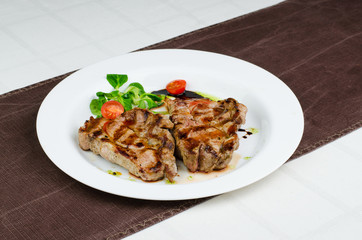 Grilled Pork Fillet With Cherry Tomatoes, Green Leaves And Green Pesto 