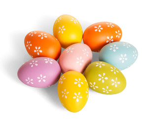 Easter eggs, laid out in shape flower, isolated on white.