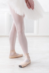 Ballerina legs closeup in fourth position